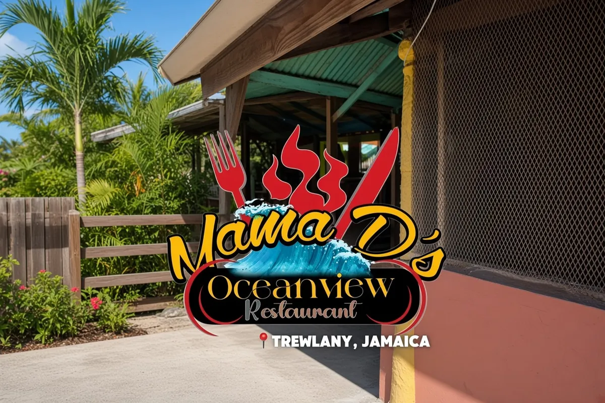 The Mama D's Oceanview Restaurant sign across the building front, palms and a wooden fence alongside